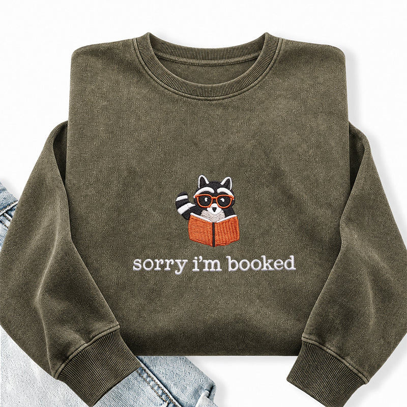 Embroidered Sorry I'm Booked Reading Raccoon Washed Crewneck Sweatshirt