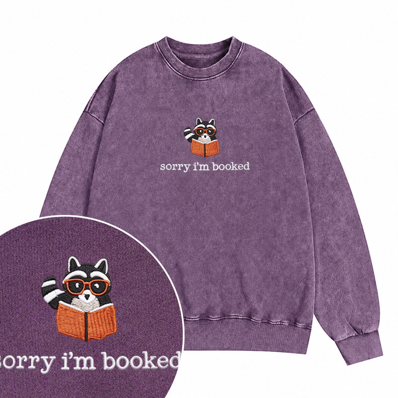Embroidered Sorry I'm Booked Reading Raccoon Washed Crewneck Sweatshirt