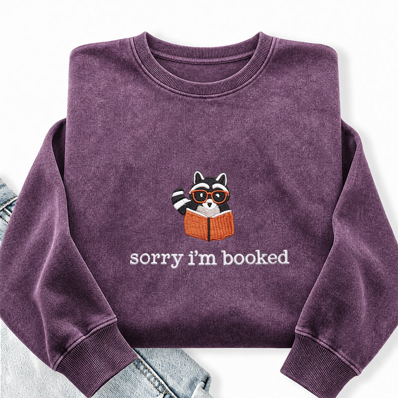 Embroidered Sorry I'm Booked Reading Raccoon Washed Crewneck Sweatshirt